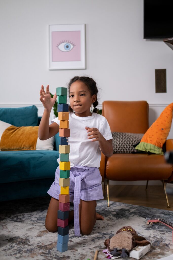 young girl playing with blocks